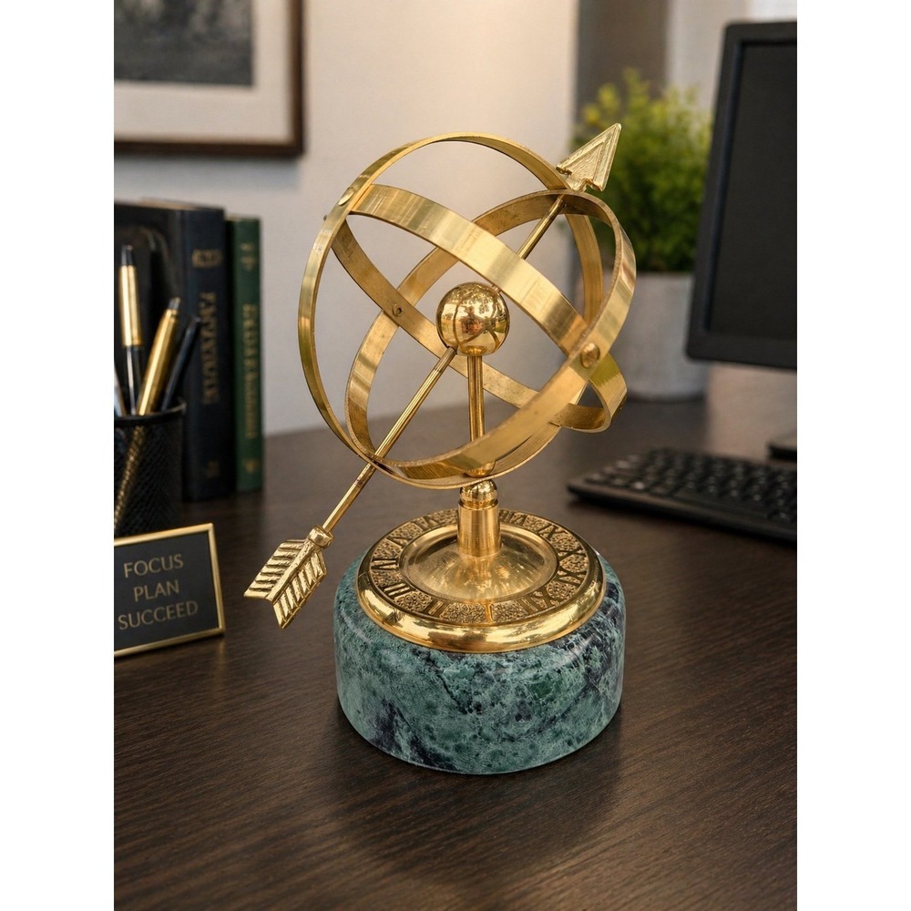 Brass armillary sphere with arrow on a marble pedestal with faux sundial